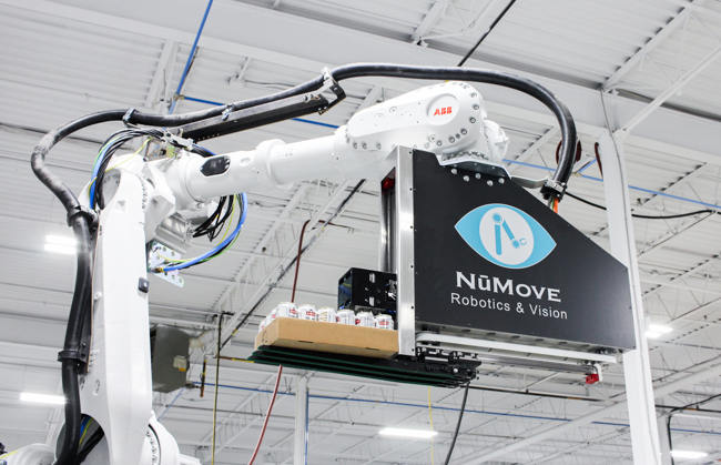 picking robot handling a tray of beverage product